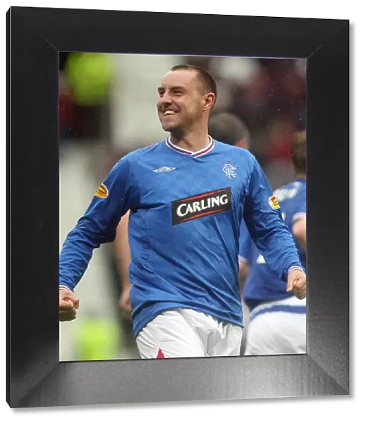 Rangers Kris Boyd: The Thrill of Victory - Celebrating the Winning Goal Against Hearts in the Scottish Premier League at Tynecastle Stadium (1-2)