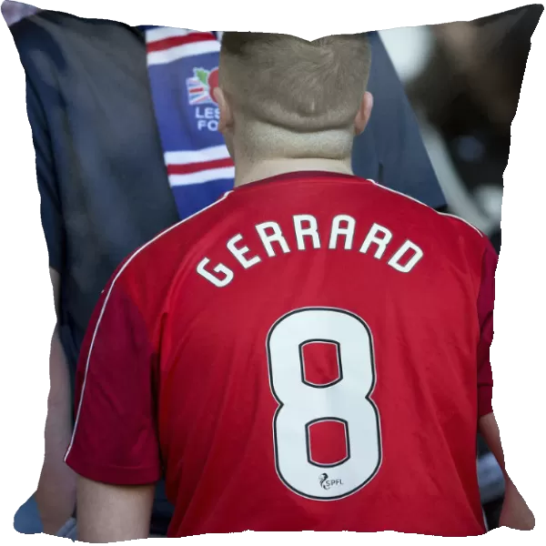Rangers Fan in Liverpool's Steven Gerrard Shirt: A Unique Tribute at Ibrox Stadium During the Pre-Season Friendly vs Bury (Scottish Cup Winning Moment)