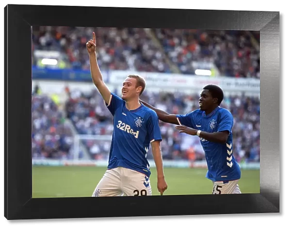 Rangers Zak Rudden and Serge Atakayi: Celebrating a Goal at Ibrox Stadium