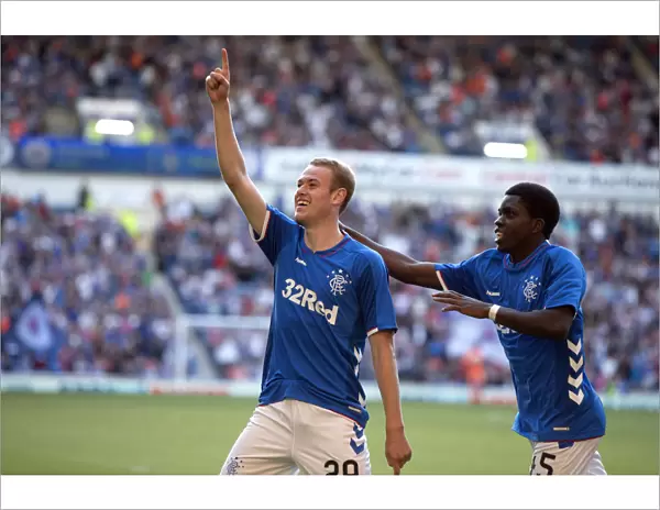 Rangers Zak Rudden and Serge Atakayi: Celebrating a Goal at Ibrox Stadium