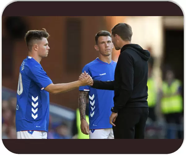 Rangers Manager Steven Gerrard in Deep Consultation with Glenn Middleton and Ryan Jack at Ibrox Stadium