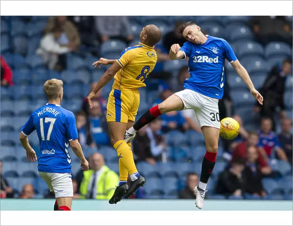 Rangers vs Wigan Athletic: Kyle Bradley's Aerial Battle at Ibrox Stadium