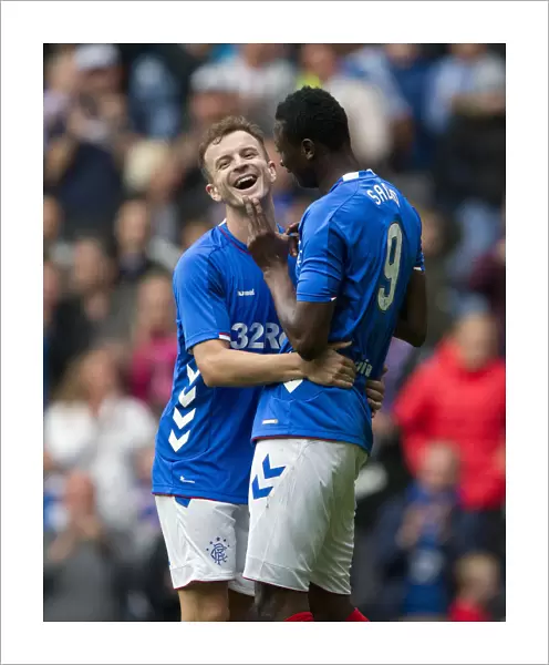 Rangers Triumph: Andy Halliday and Umar Sadiq's Euphoric Moment as They Celebrate the Third Goal vs. Wigan Athletic at Ibrox Stadium