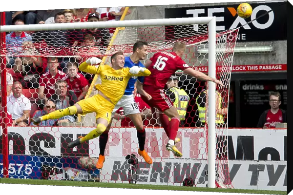 McGregor vs. Cosgrove: A Fierce Battle for the Ball at Pittodrie Stadium
