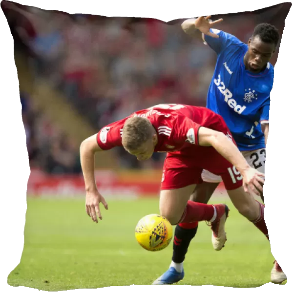 Rangers vs Aberdeen: Lassana Coulibaly Fouls Lewis Ferguson in Intense Ladbrokes Premiership Clash at Pittodrie Stadium