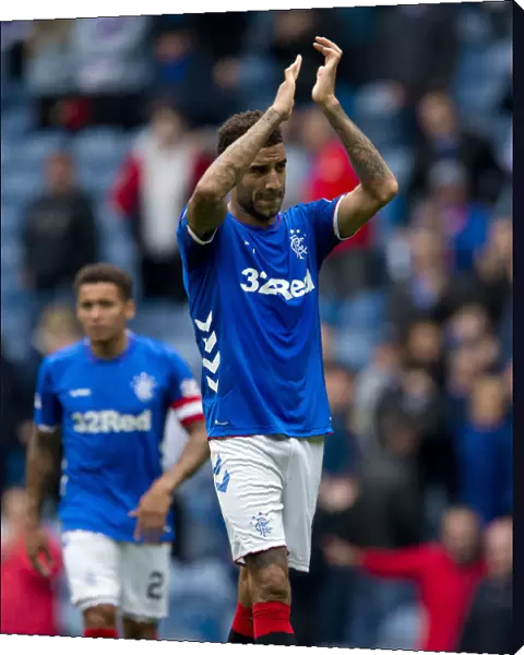 Rangers Connor Goldson Embraces Victory and Fans in Ibrox Stadium