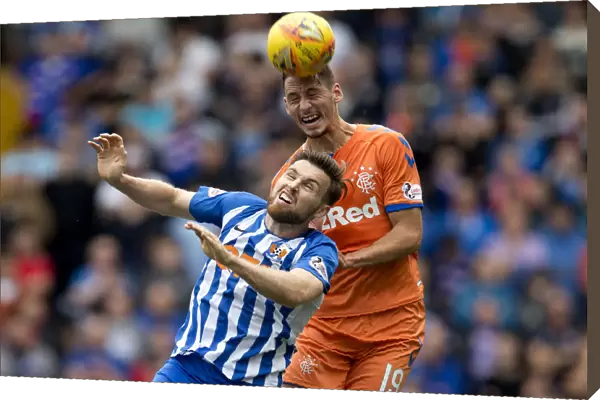 Rangers Nikola Katic Soars Over Kilmarnock's Stephen O'Donnell in Betfred Cup Showdown at Rugby Park