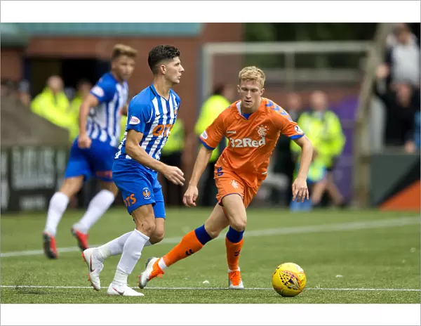Rangers Ross McCrorie in Pursuit: The Betfred Cup Showdown at Rugby Park vs. Kilmarnock