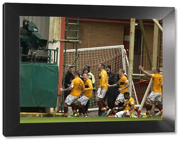 Motherwell's Peter Hartley Scores and Celebrates with Team Mates Against Rangers in the Ladbrokes Premiership at Fir Park