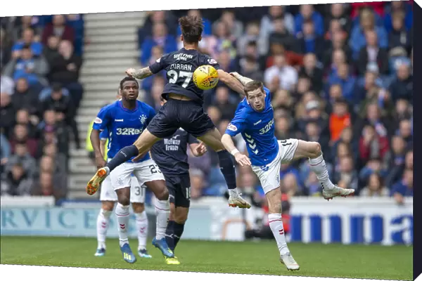 Rangers vs Dundee: Ryan Kent Leaps for the Ball in Ladbrokes Premiership Action at Ibrox Stadium