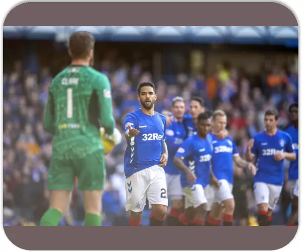 Rangers Daniel Candeias: Embracing Victory - Celebrating Goal with Match Ball at Ibrox Stadium