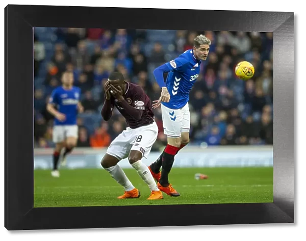 Rangers vs Hearts: Kyle Lafferty Leaps for the Ball in the Ladbrokes Premiership at Ibrox Stadium