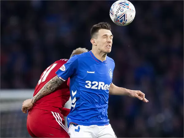 Rangers Ryan Jack Heads the Ball in Betfred Cup Semi-Final Showdown at Hampden Park