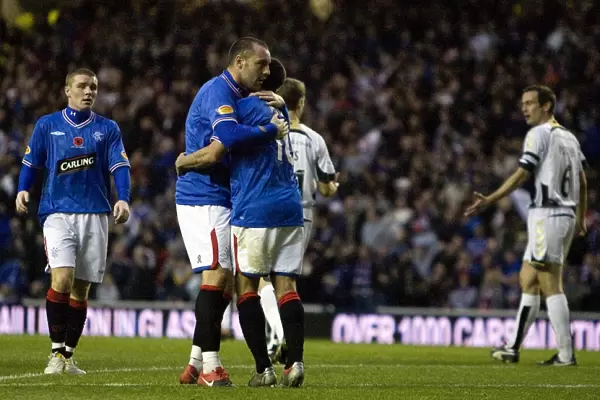 Rangers Kris Boyd and Nacho Novo: A Dynamic Duo Celebrating a Hard-Fought 2-1 Victory Over St. Mirren at Ibrox Stadium