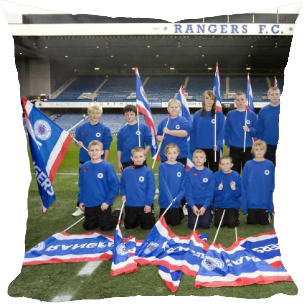 Rangers Kids Celebrate 2-1 Victory Over St Mirren at Ibrox Stadium with Flags