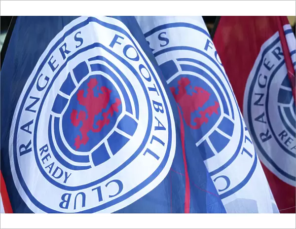 Scottish Premiership Clash at Ibrox Stadium: Waves of Rangers Flags (Scottish Cup Victory 2003)