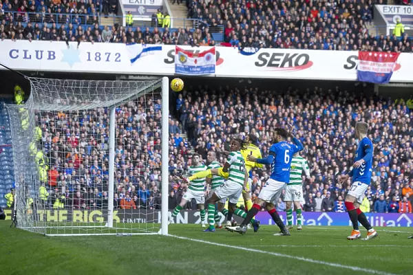 Scott Brown's Close Call: Heading Towards the Crossbar in the Intense Rangers vs Celtic Rivalry at Ibrox Stadium