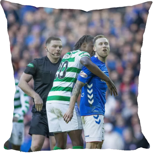 Rangers vs Celtic: Intense Moment as Scott Arfield Confronts Kris Ajer Amidst Heated Rivalry at Ibrox Stadium