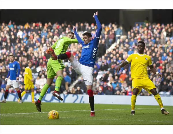 Rangers vs HJK Helsinki: Kyle Lafferty Leaps for the Ball at Ibrox Stadium