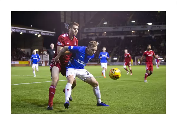 Scott Arfield Shields Ball in Rangers vs Aberdeen Clash at Pittodrie Stadium