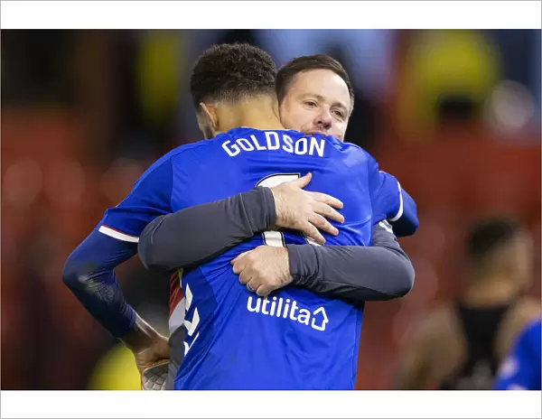 Rangers Goldson and Beale Celebrate Scottish Premiership Victory at Pittodrie Stadium