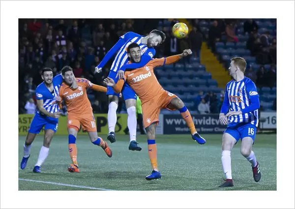 Rangers Connor Goldson Leaps Over Kirk Broadfoot in Fifth Round Scottish Cup Clash at Rugby Park