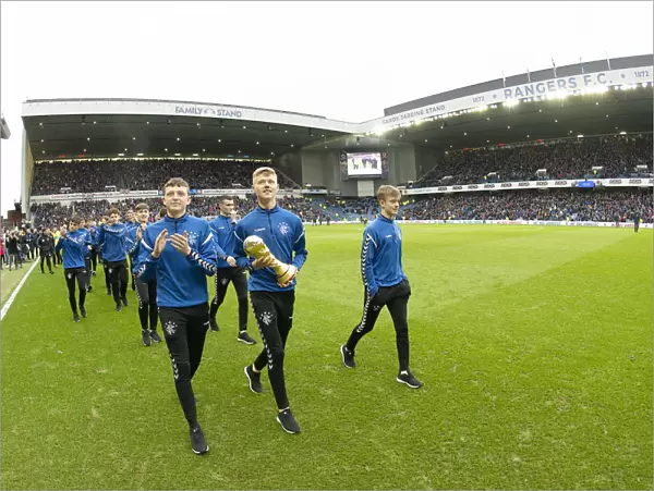 Rangers U17 Team Celebrates Double Victory: Scottish Premiership and Al Kass International Cup Parade at Ibrox Stadium