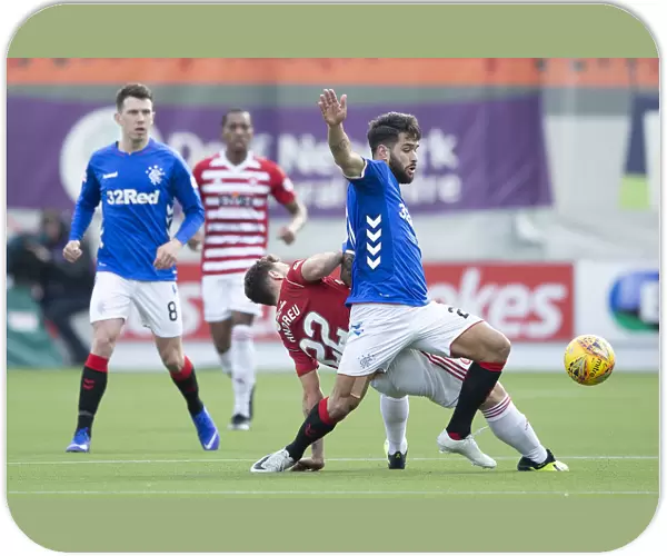 Rangers Daniel Candeias Secures the Ball in Intense Scottish Premiership Clash at Hamilton's Hope Central Business District Stadium