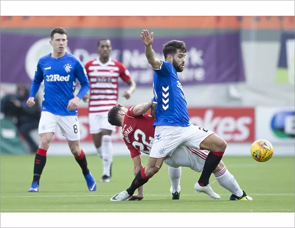 Rangers Daniel Candeias Secures the Ball in Intense Scottish Premiership Clash at Hamilton's Hope Central Business District Stadium