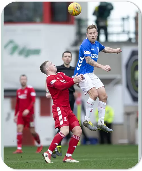 Scott Arfield Heads the Ball: Rangers vs Aberdeen - Scottish Cup Quarter-Final at Pittodrie Stadium