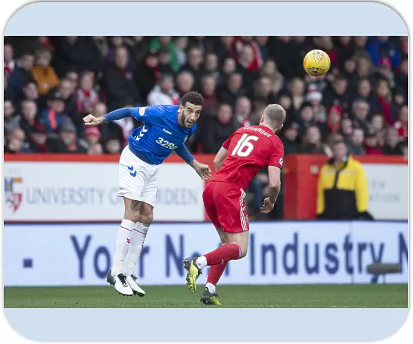 Rangers Connor Goldson Heads the Ball in Scottish Cup Quarter-Final at Pittodrie Stadium