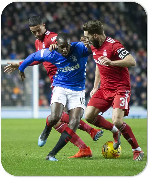 Glasgow Rangers vs Aberdeen: Glen Kamara's Gritty Battle for the Ball - Scottish Cup Quarter Final Replay at Ibrox Stadium