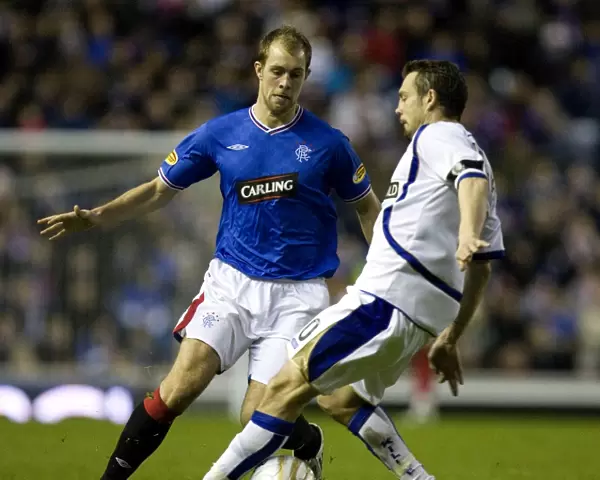Rangers Steven Whittaker Evades David Fernandez: Triumphant Moment in 3-0 Clydesdale Bank Premier League Victory at Ibrox Stadium