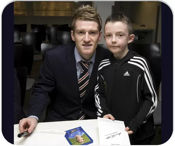 Rangers Football Club: Steven Davis Engages with Young Fan at Junior AGM (2009)