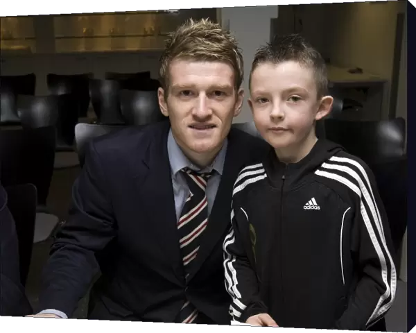 Rangers Football Club: Steven Davis Engages with Young Fan at Junior AGM (2009)