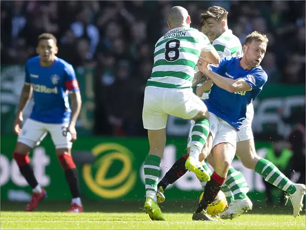 Scottish Derby: Arfield vs. Brown - Intense Tackle at Celtic Park