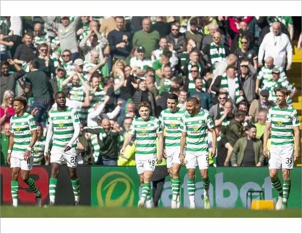 Celtic's James Forrest Scores and Celebrates with Team Mates in Celtic Park during Scottish Premiership Match against Rangers