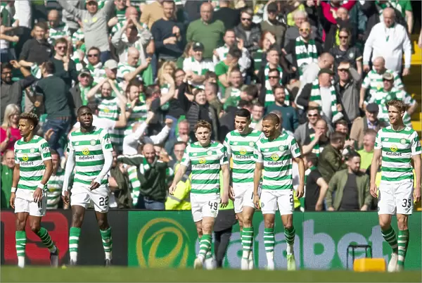 Celtic's James Forrest Scores and Celebrates with Team Mates in Celtic Park during Scottish Premiership Match against Rangers