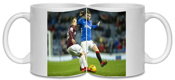 Intense Moment: Jon Flanagan Tackles Jamie Brandon in Rangers vs Hearts Scottish Premiership Clash at Ibrox Stadium