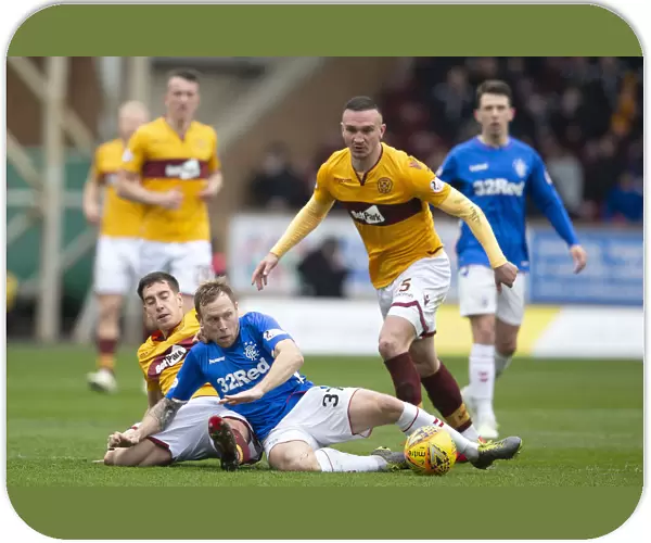 Scott Arfield's Determined Battle for Possession: Motherwell vs Rangers - Scottish Premiership's Intense Showdown