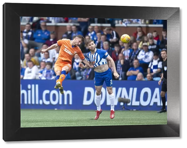 Rangers Borna Barisic Leaps Over Kilmarnock's Stephen O'Donnell in Scottish Premiership Clash at Rugby Park