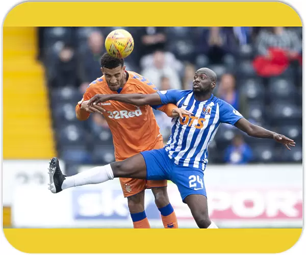 Rangers Connor Goldson Faces Off Against Kilmarnock's Youssouf Mulumbu in Scottish Premiership Clash at Rugby Park
