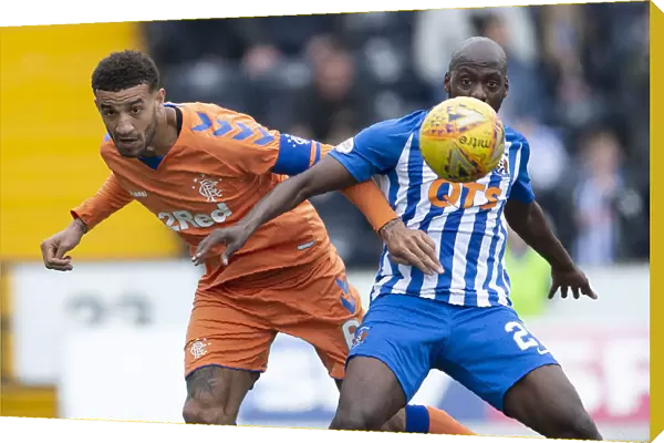 Rangers Connor Goldson vs. Kilmarnock's Youssouf Mulumbu: Intense Face-Off in Scottish Premiership Clash at Rugby Park