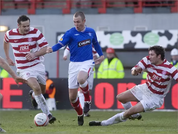 Rangers Kenny Miller Evades Hamilton's Canning and McLaughlin in Thrilling Scottish Cup Showdown