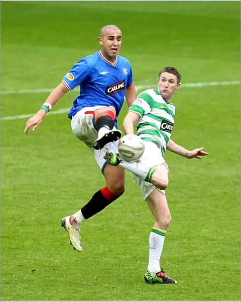 Intense Rivalry: Bougherra vs Keane - A Pivotal Moment in the 1-0 Rangers Victory at Ibrox Stadium