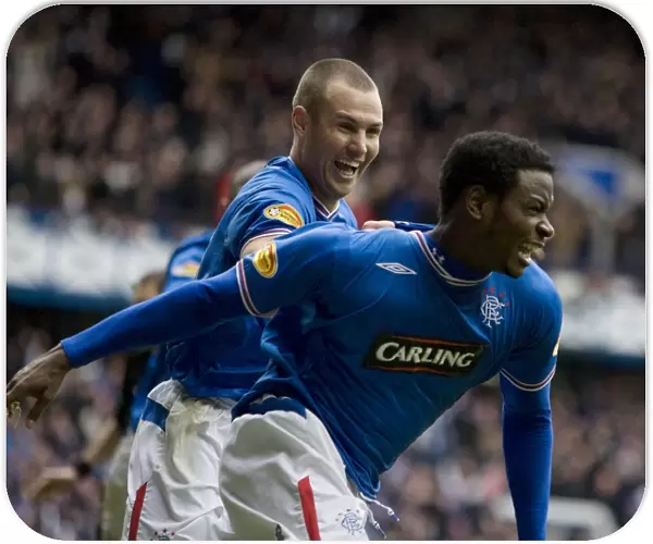 Rangers Maurice Edu Scores Game-Winning Goal Against Celtic: Euphoric Celebration with Kenny Miller (Clydesdale Bank Premier League)