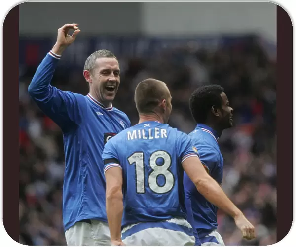 Rangers vs Celtic: David Weir and Kenny Miller Celebrate Maurice Edu's Game-Winning Goal (1-0) at Ibrox, Clydesdale Bank Premier League