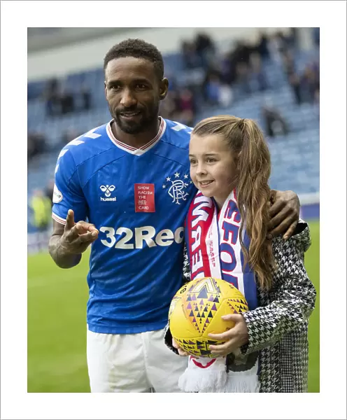 Rangers Defoe and Young Fan Amber Smith Share Hat-trick Moment at Ibrox Stadium