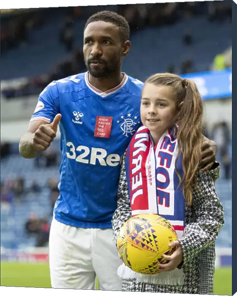 Rangers Defoe and Young Fan Share Unforgettable Hat-trick Moment at Ibrox Stadium