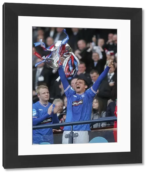 Rangers Football Club: Lee McCulloch Lifts the Co-operative Insurance Cup at Hampden